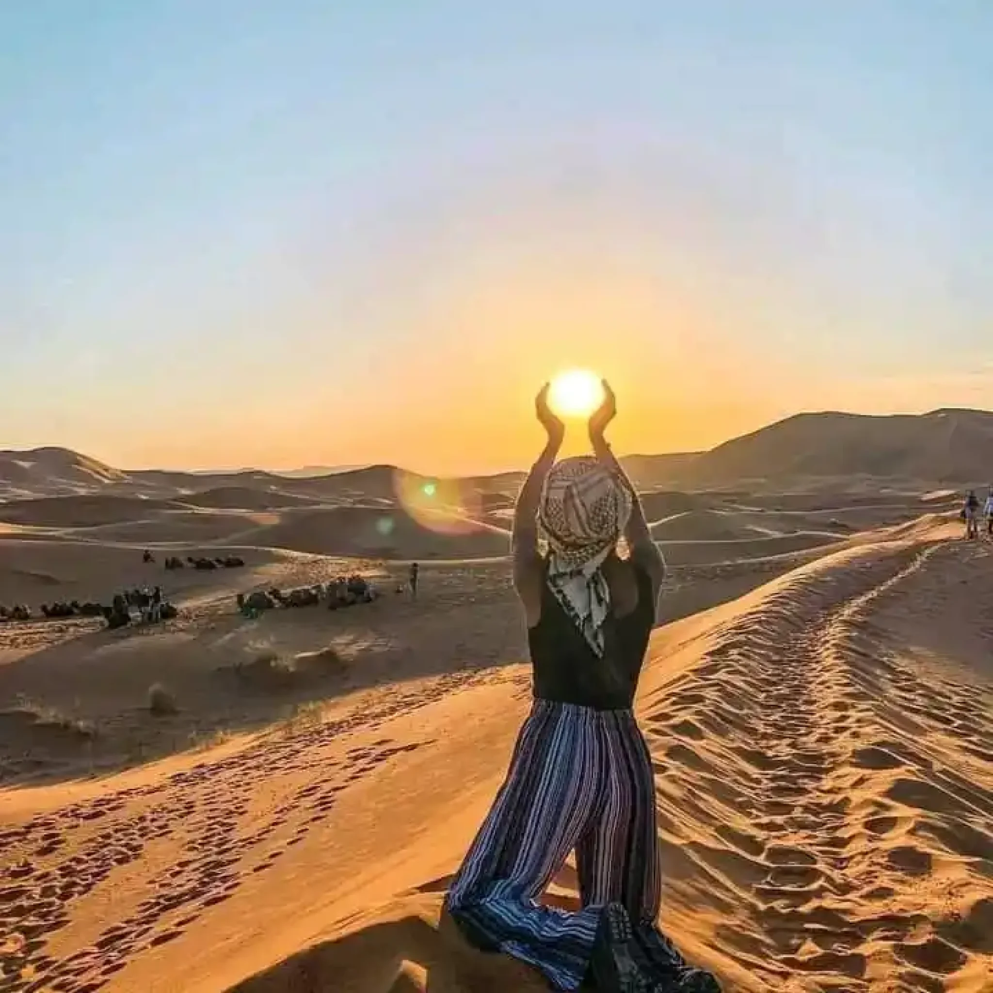 Image capturing the sweeping panorama of the Agafay desert's endless sand dunes, embodying the tranquil and stark beauty encountered en route to an unforgettable day trip.