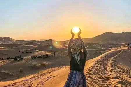 Image capturing the sweeping panorama of the Agafay desert's endless sand dunes, embodying the tranquil and stark beauty encountered en route to an unforgettable day trip.